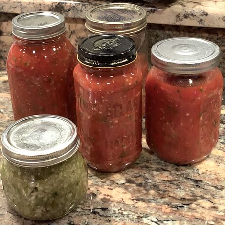 The red jars are the finished salsa. The green is after the first two steps.